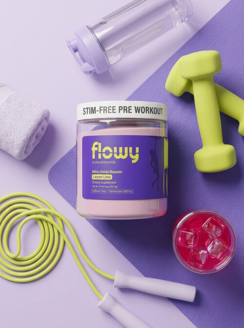 Flowy tub laid out with dumbbells, jump rope and a mat